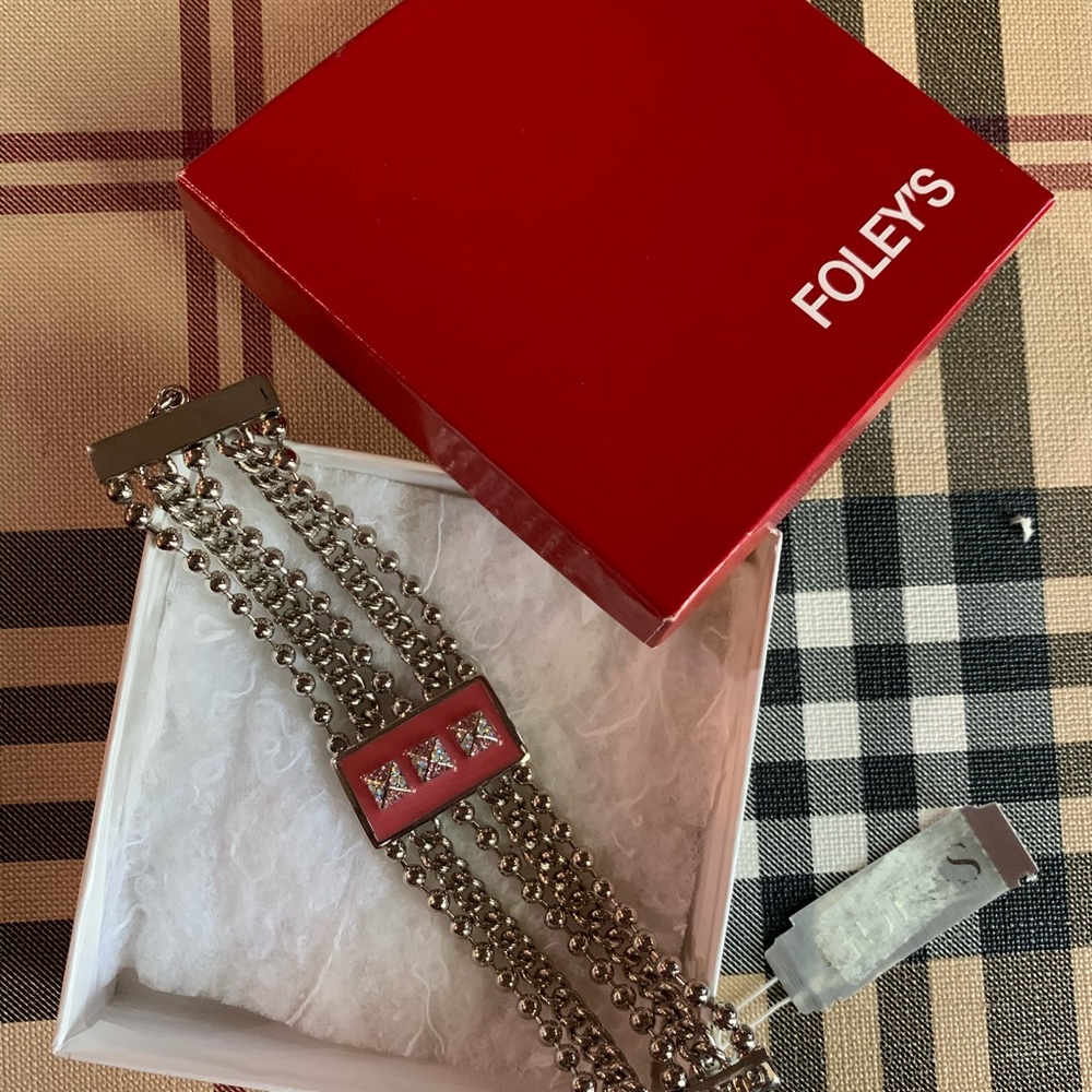 Guess toggle bracelet in dusty rose pink.